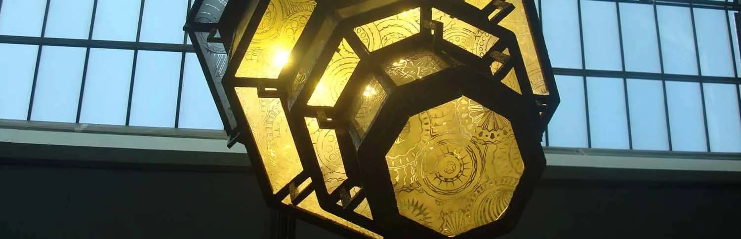 Antique lanterns emitting warm light, featuring intricate patterns, creating a cozy atmosphere.